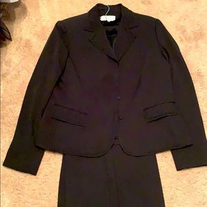 Black pantsuit with a matching blouse.